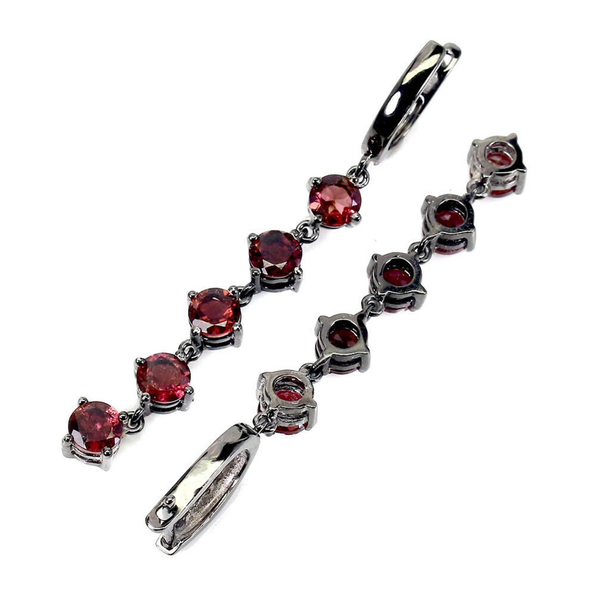 A pair of 925 silver rodium plated drop earrings set with round cut garnets, L. 5.5cm. - Image 2 of 2