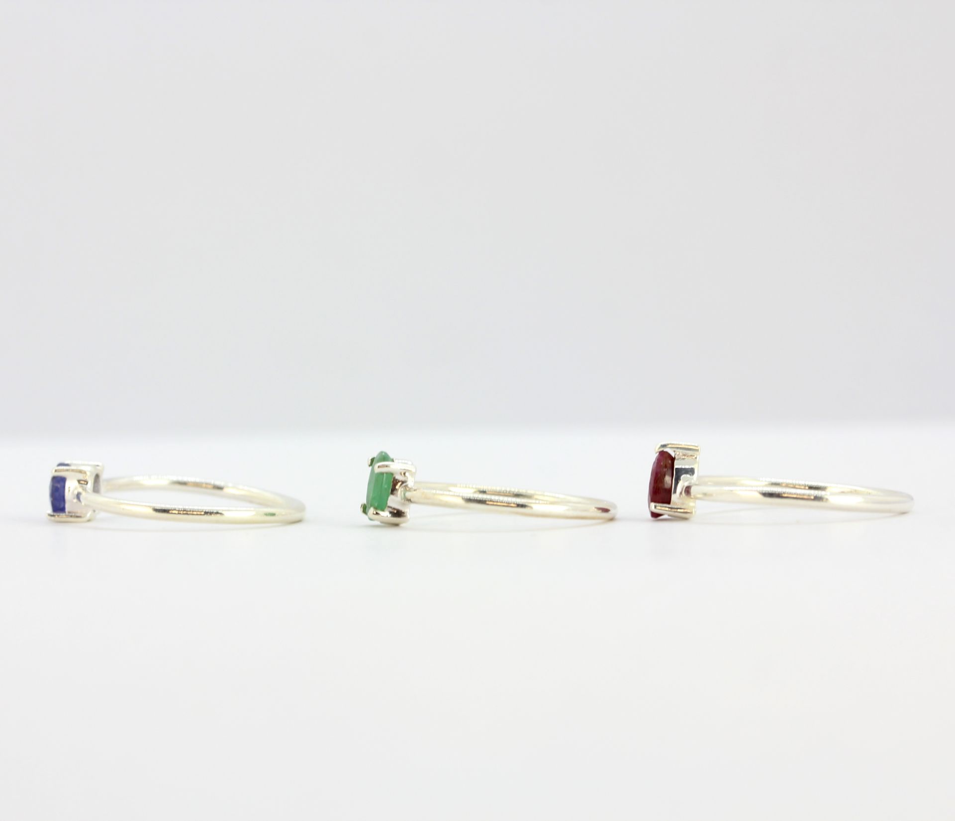 Three 925 silver stacking rings set with ruby, emerald and sapphire. - Image 2 of 2