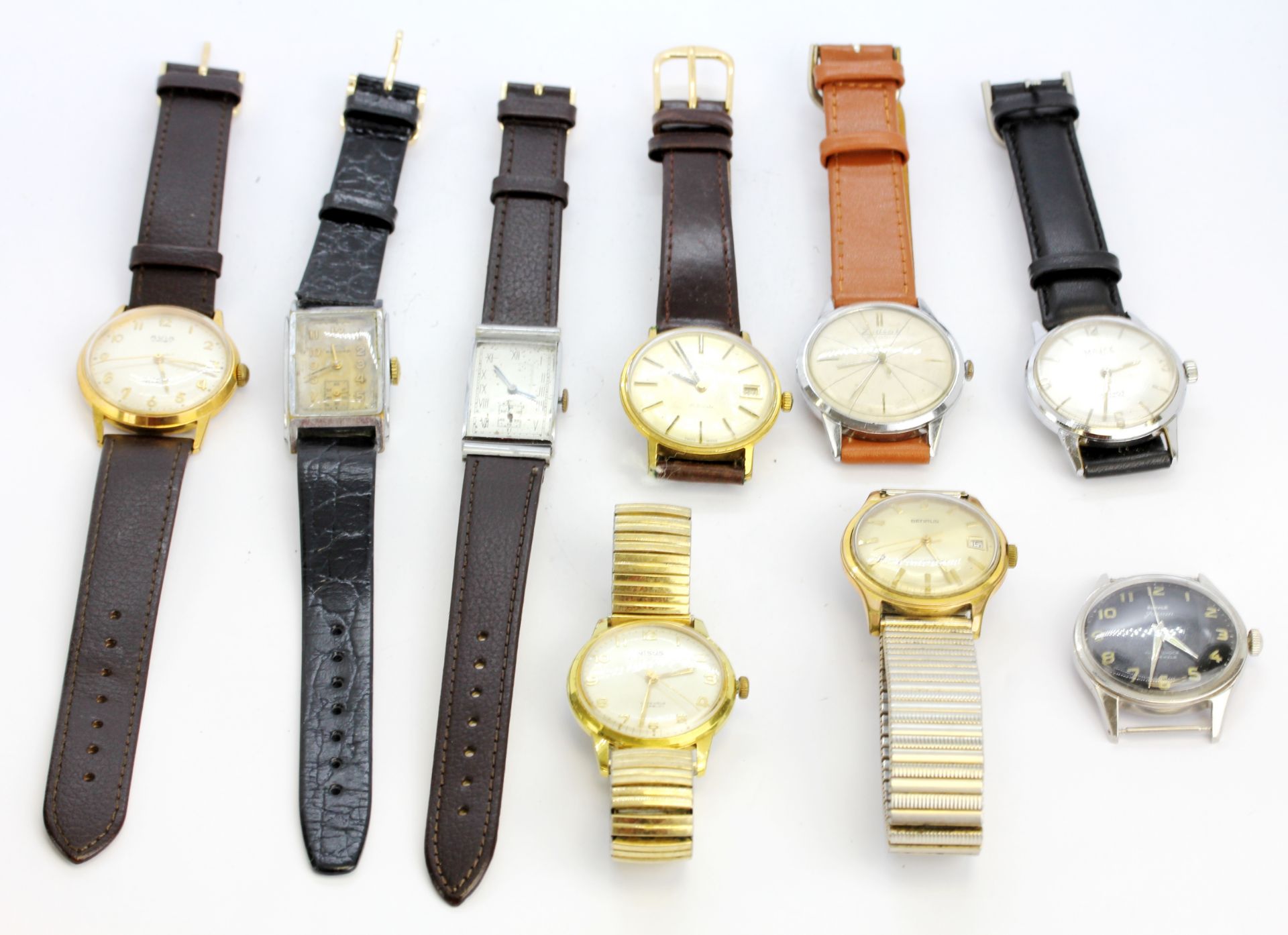 A group of eight wristwatches with a further watch face, including Rotary and Record.