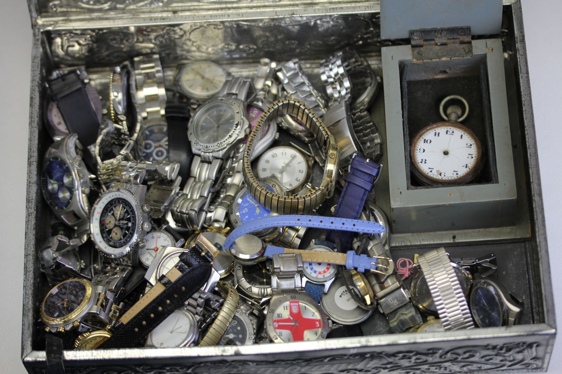 A vintage metal tin containing a quantity of mixed wristwatches inclusing a boxed pocketwatch. - Image 2 of 3