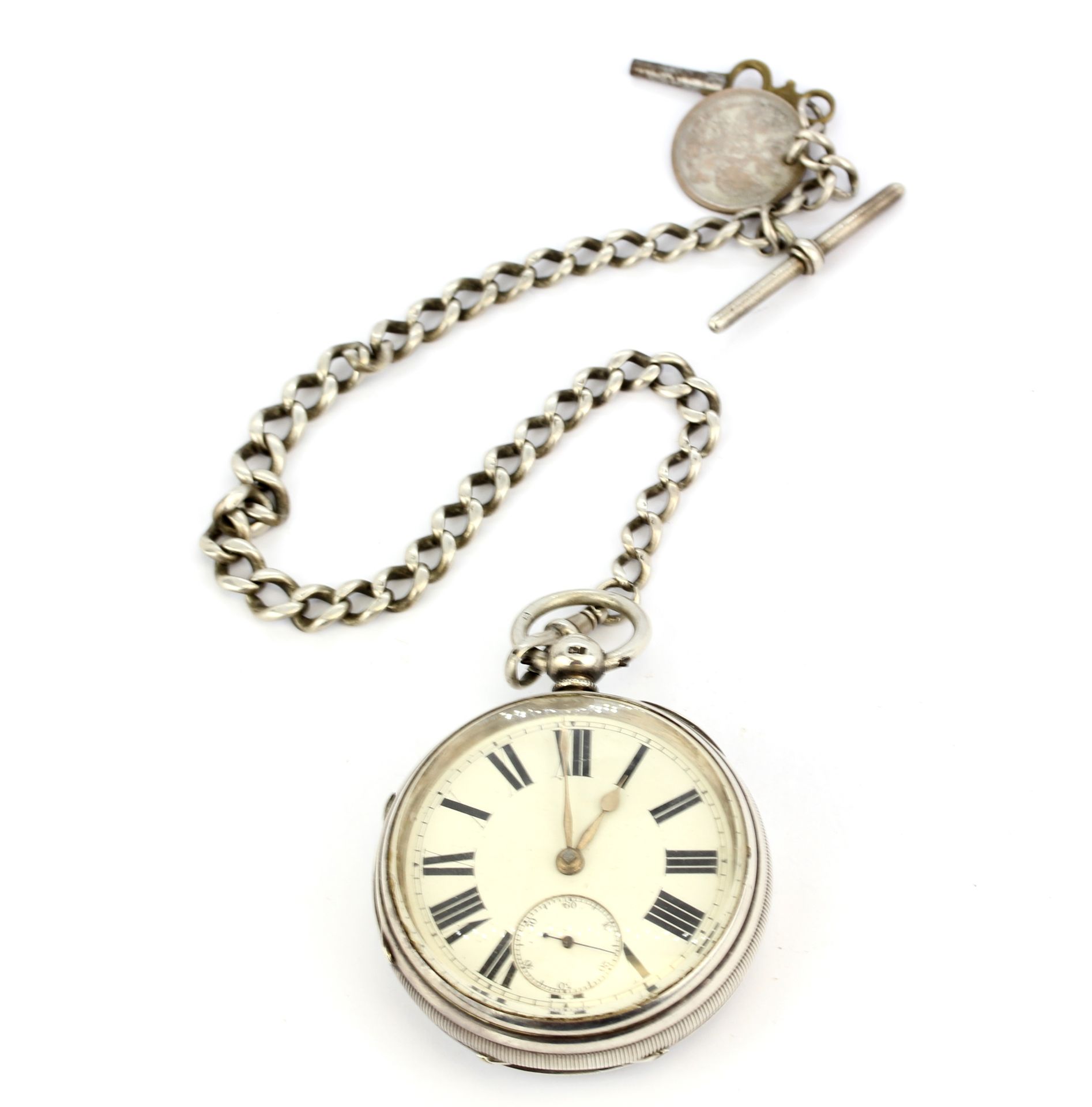 A heavy hallmarked silver cased key wind pocketwatch on a hallmarked silver Albert chain with key.