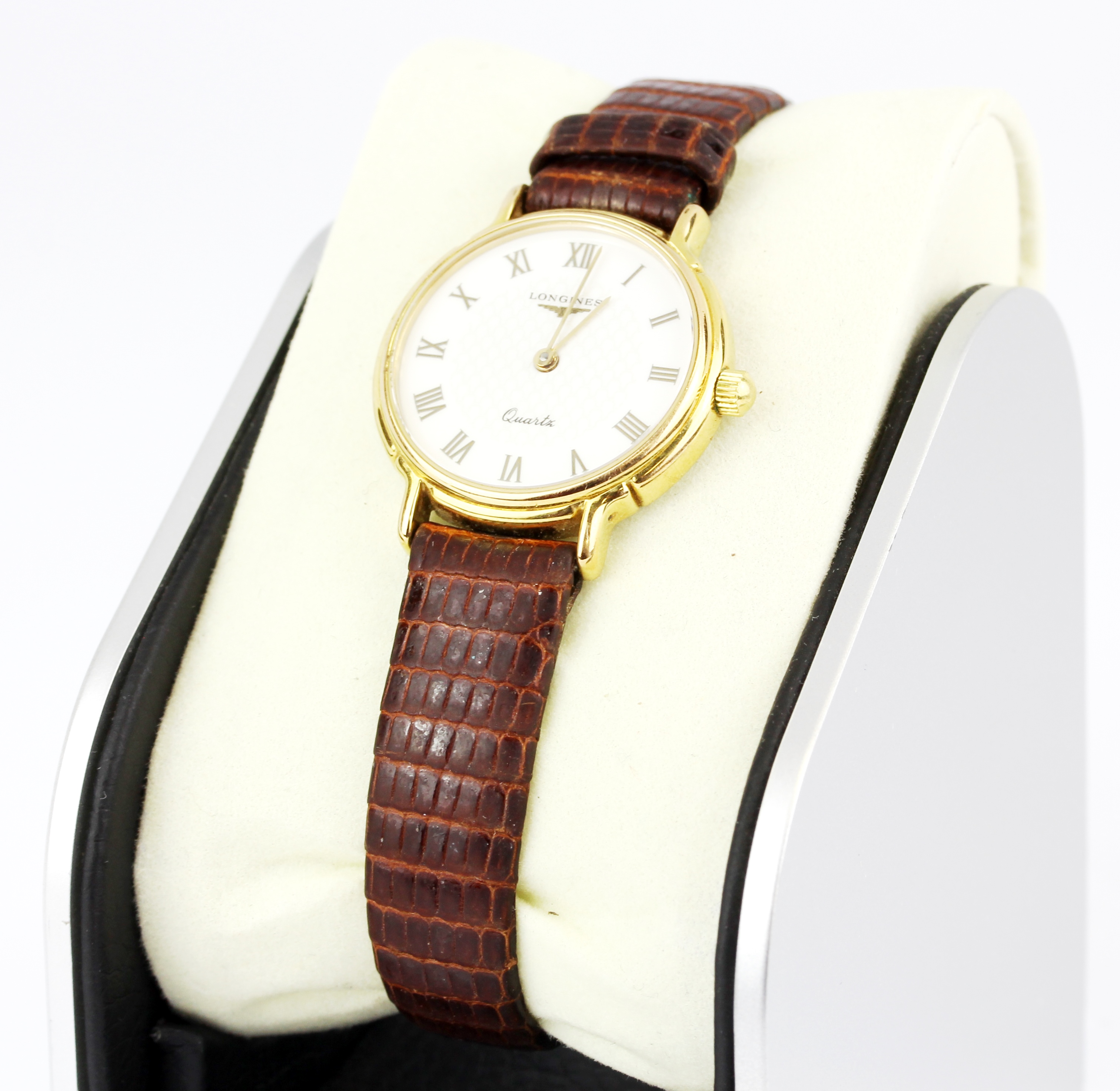 A Longines gold plated wristwatch (no. 24445181 7044) on a brown leather strap.