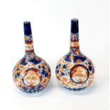 A pair of 19th Century Japanese Imari vases, H. 18cm.