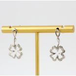 A pair of 9ct white gold shamrock shaped drop earrings set with diamonds, L. 2cm.