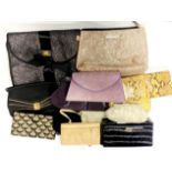 A group of vintage handbags and purses.