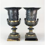 A pair of classical style bronze urns on marble bases, H. 38cm.