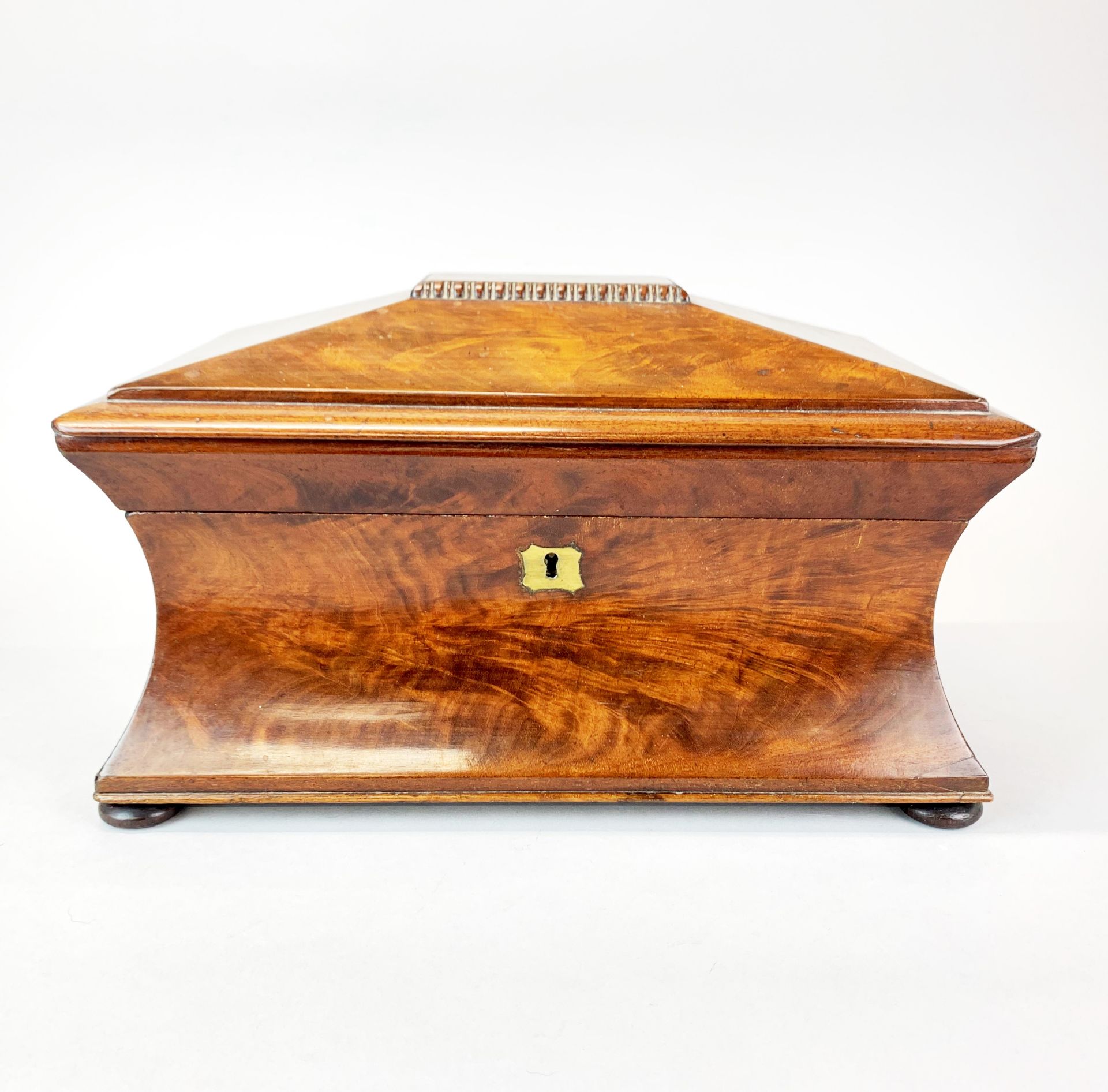 A Georgian mahogany tea caddy, 36 x 20 x 21cm. together with a glass mixing bowl.