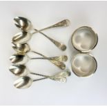 A set of six hallmark silver tea spoons with two hallmark silver napkin rings.