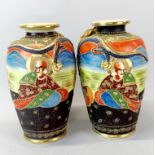 A pair of large Japanese satsuma vases, H. 30cm. minor damage to one dragon head.