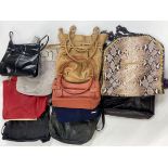 A group of mixed lady's leather handbags.