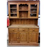 A pine kitchen dresser, W. 137cm, H. 200cm.