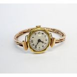 A 1920's lady's 18ct gold wristwatch with a 9ct gold expandable strap.