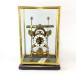 A glass cased brass 'grasshopper' clock, case size 31 x 21 x 49cm.