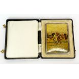 A cased hallmark silver cigarette case with polo playing outer decoration, 8.5 x 11.5cm.