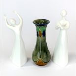 A Royal Doulton stoneware vase with two Royal Doulton figurines 'Peace' and 'Awakening', vase H.