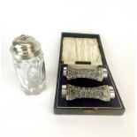 A cased pair of cut crystal and hallmark silver knife rests, London c. 1929. together with a