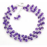 A 925 silver bracelet set with three rows of amethyst beads, L. 17cm.