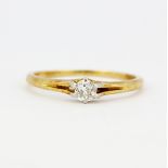 An 18ct yellow gold solitaire ring set with an old brilliant cut diamond, (P).