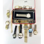 A tin of mixed watches.