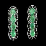 A pair of 925 silver earrings set with oval cut emeralds and spinels.