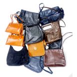 A group of mixed vintage lady's handbags.