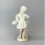 A 19th Century carved marble figure of a girl with a basket of flowers, H. 35cm.