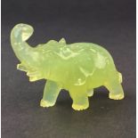 A small carved jade figure of an elephant, L. 6cm. H. 4cm.