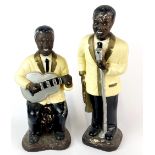 A pair of vintage painted plaster figures of Jazz musicians, tallest 35cm. A/F to guitar.