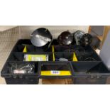 Three fishing reels and a Stanley organising box with further fishing related contents.
