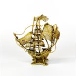 A gilt filigree model of a galleon, H. 11cm.