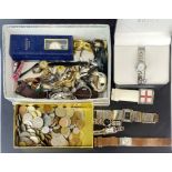 A quantity of mixed watches and coins.