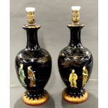 A pair of early 20th century Chinese lacquered wooden table lamps, H. 49cm.