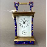 A cloisonne enamelled carriage clock, H. 21cm.