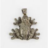 A large white and yellow metal diamond set frog shaped pendant with ruby eyes, L. 4cm.