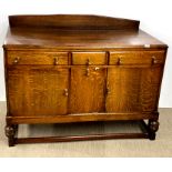 A lovely 1930's light oak sideboard, W. 136cm, H. 110cm.