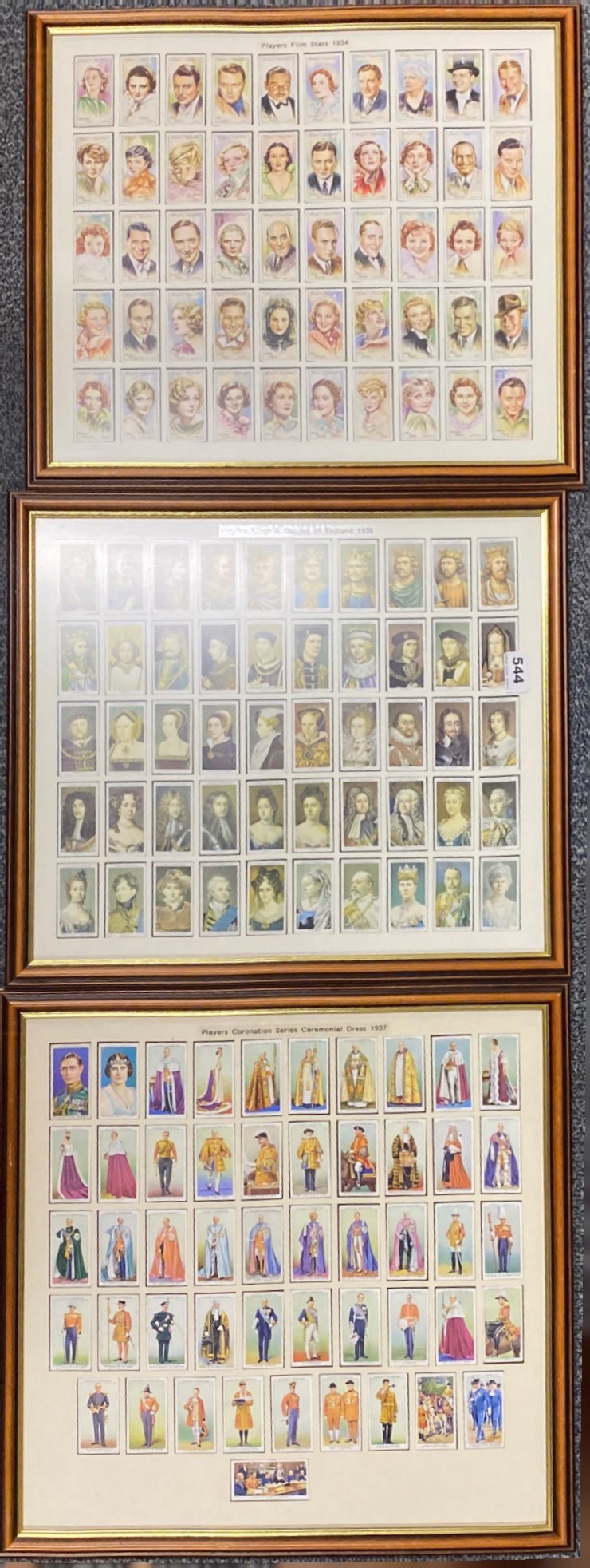 Three frames of cigarette cards.