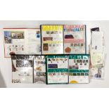 A group of first day cover stamp albums and others.