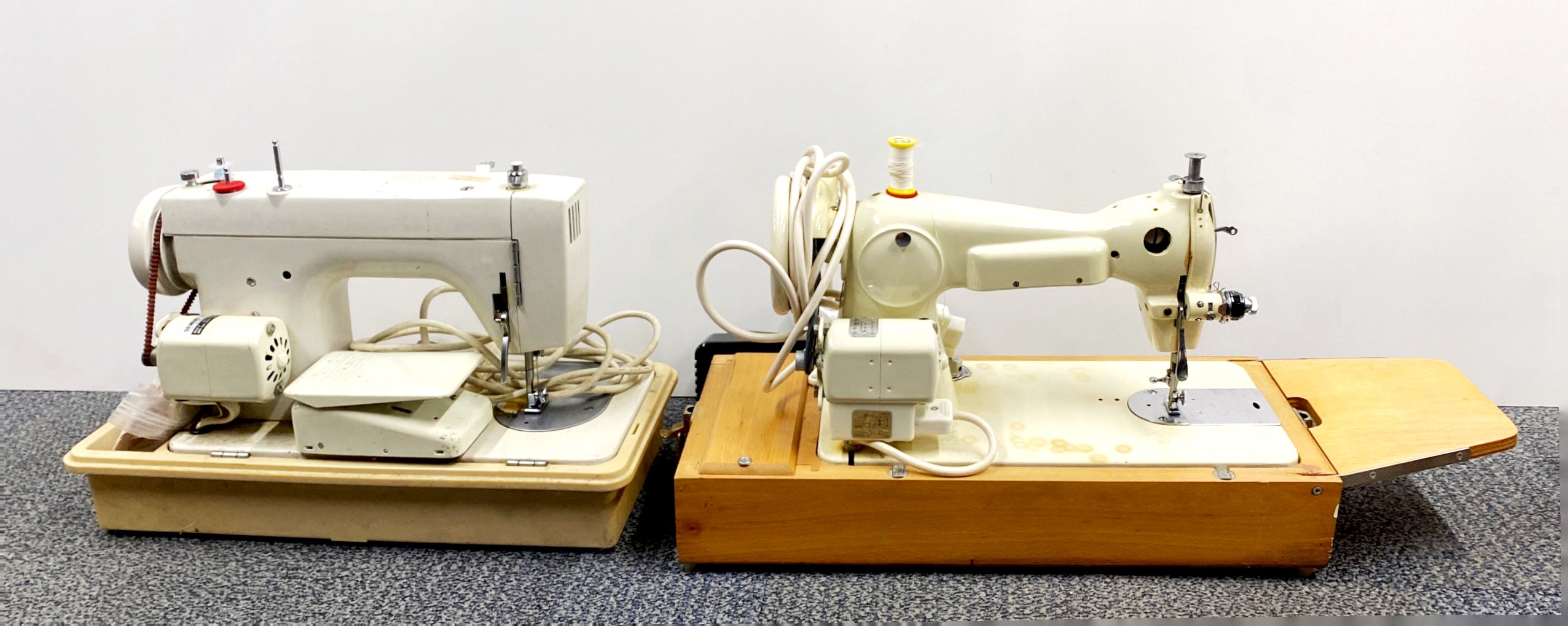 Two vintage sewing machines.