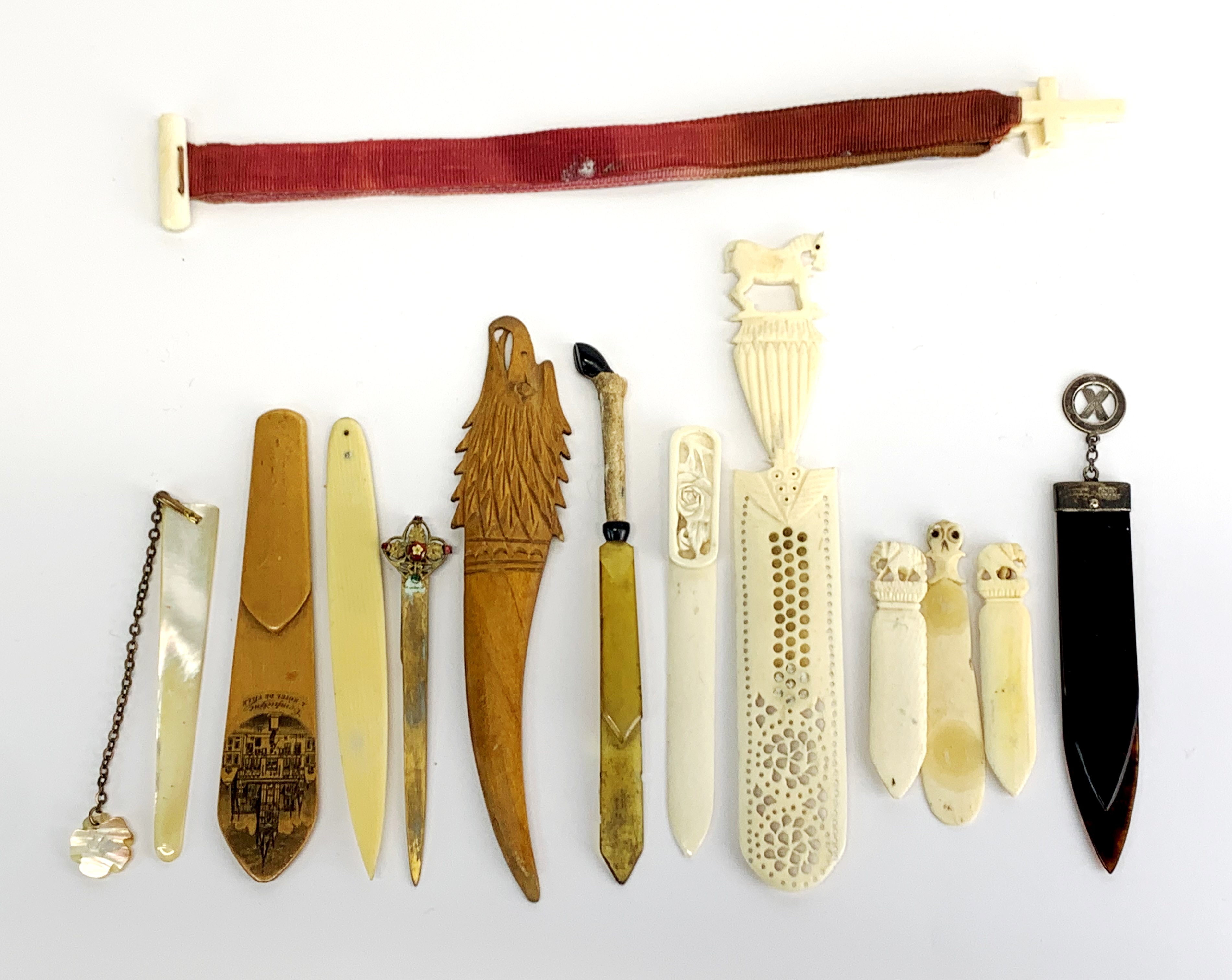 A group of antique wood, bone and other bookmarks.