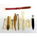 A group of antique wood, bone and other bookmarks.