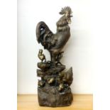 A large bronze figure of a cockerel with chicks, H. 59cm.