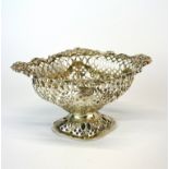A hallmarked silver pierced basket London c.1901 by Gold & Silversmiths company, W. 14cm. H. 8cm.