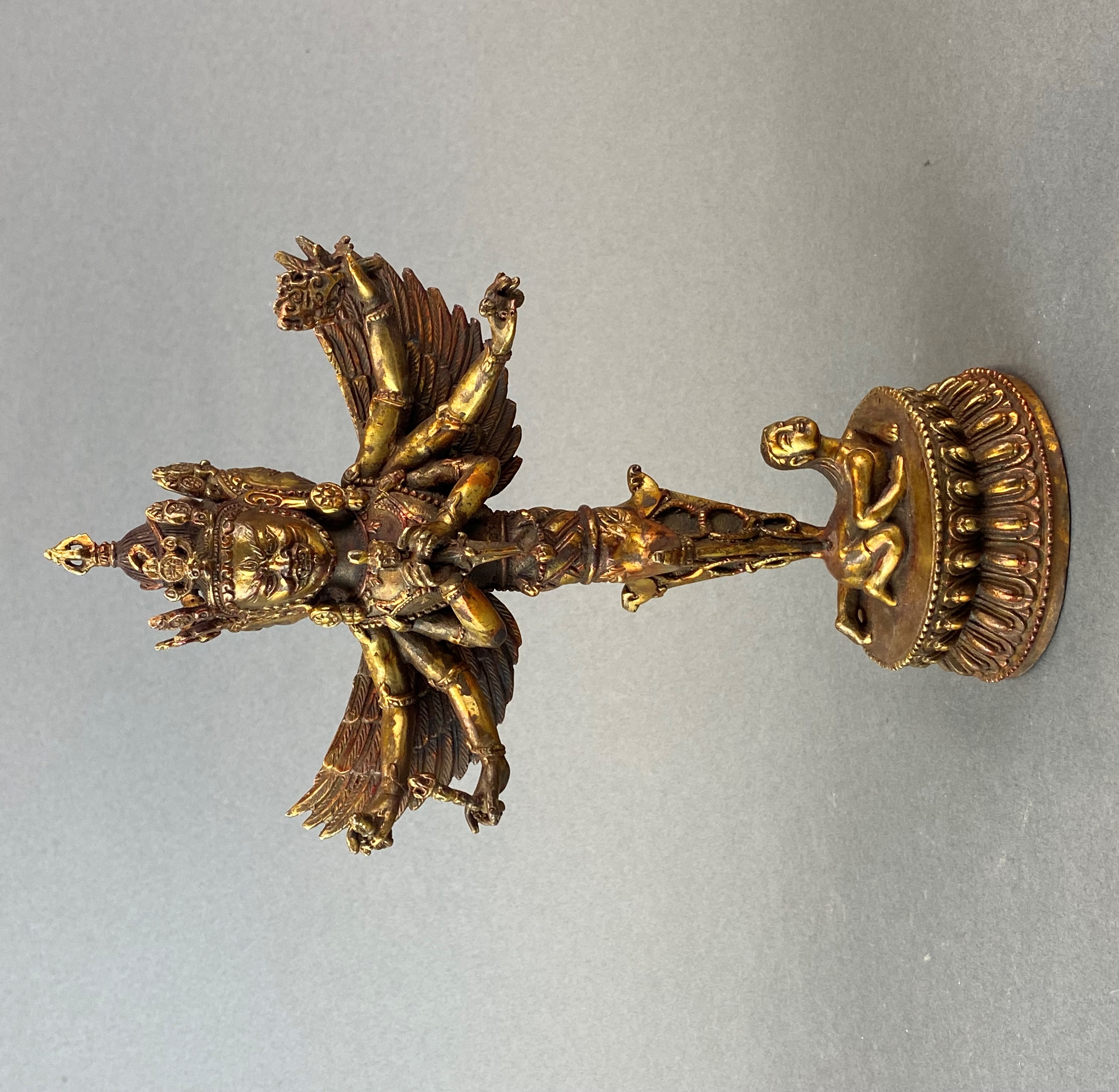 A Tibetan gilt bronze figure of a guardian deity in the form of a purba, H. 28cm.