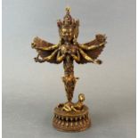 A Tibetan gilt bronze figure of a guardian deity in the form of a purba, H. 28cm.