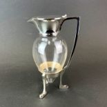 A Christopher Dresser style silver plate and glass claret jug, H. 25.5cm.