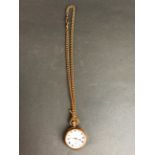 A 9ct gold open faced pocket watch (no glass) with a 9ct gold albert chain, one replacement dog