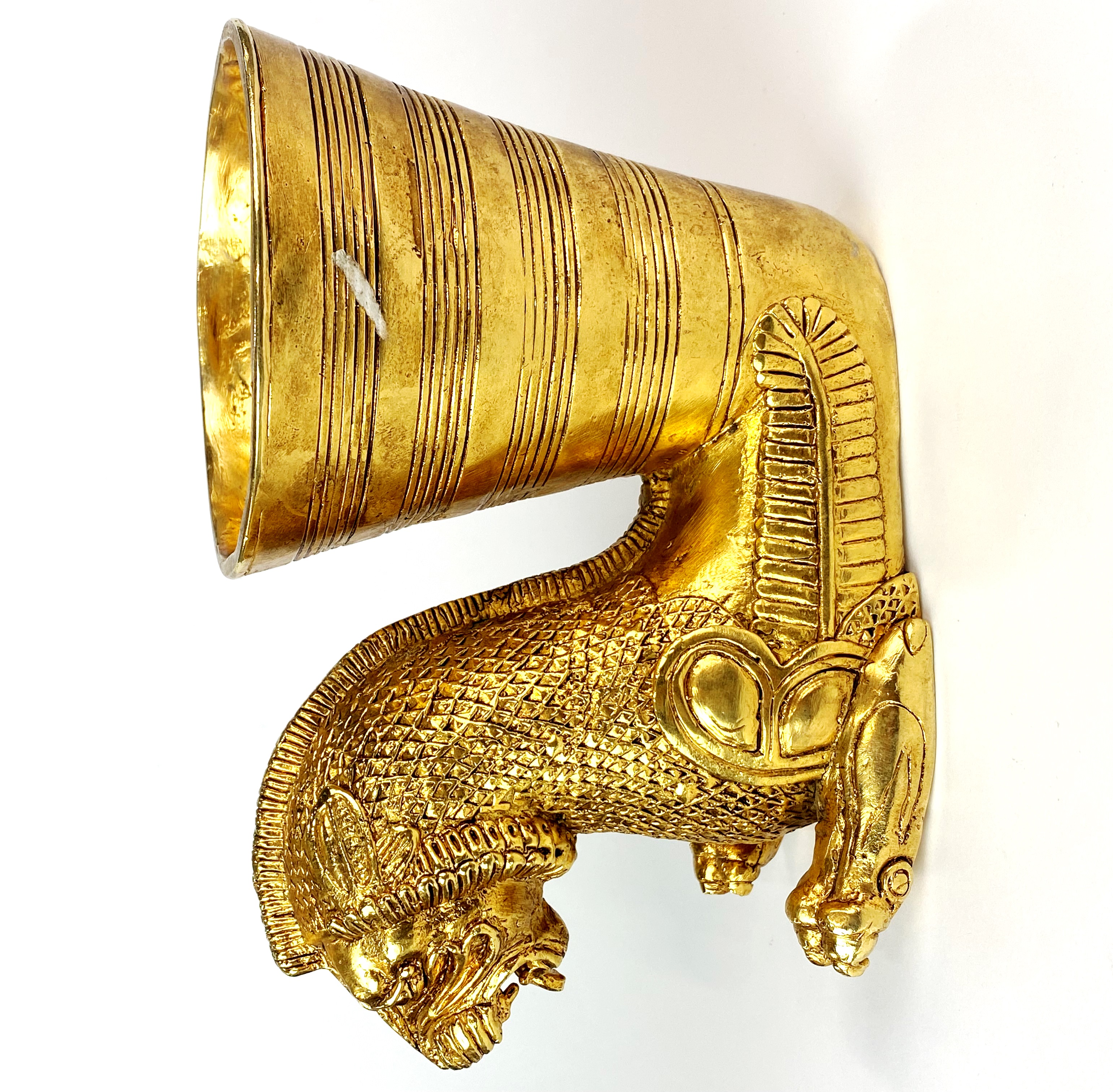 An oriental gilt bronze animal head vessel, L. 21cm, H. 14cm.