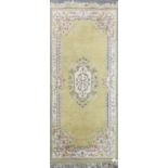 An India yellow/cream ground wool rug, 192 x 91cm.