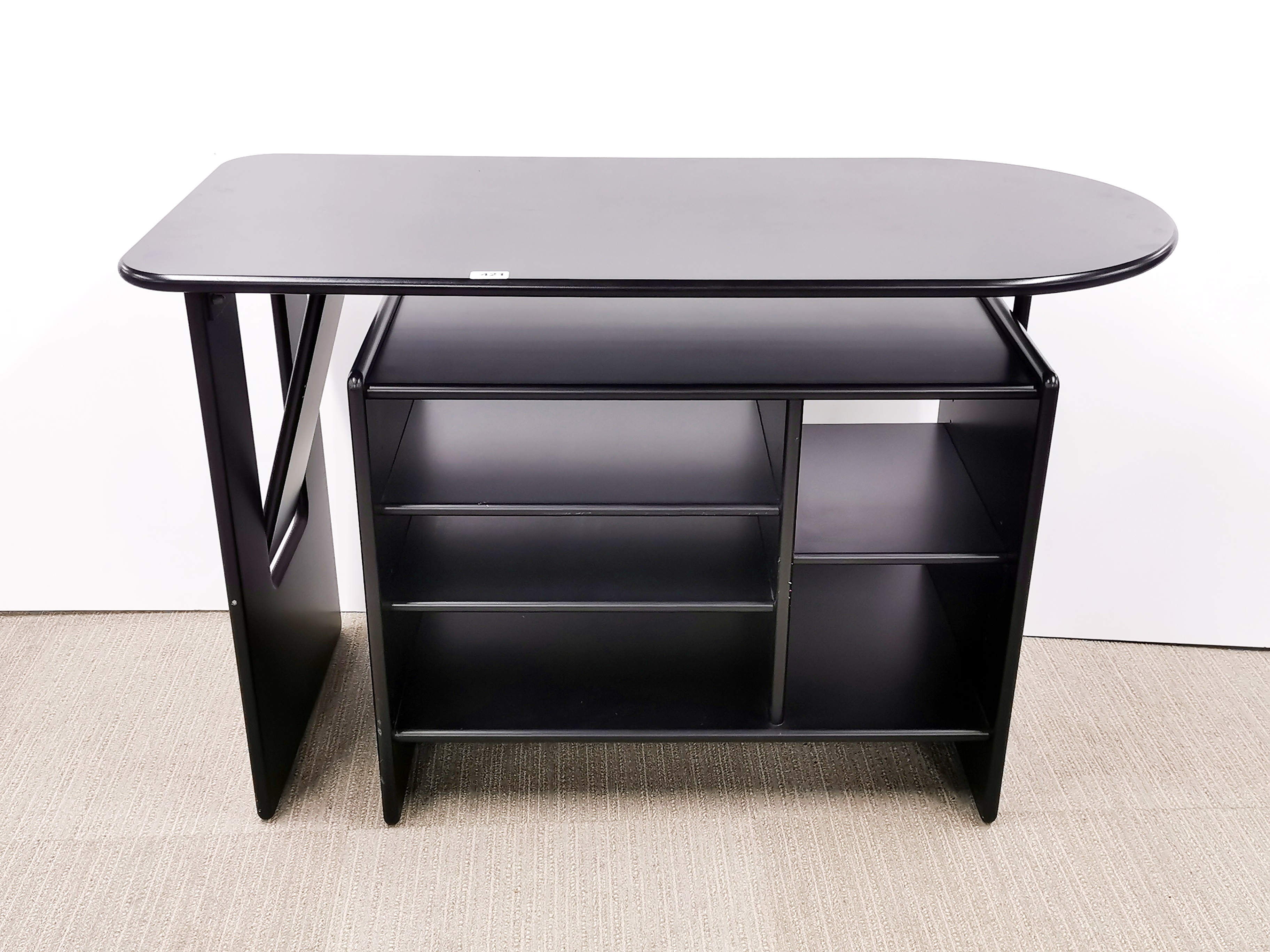 A black finished contemporary adjustable desk, W. 114cm.