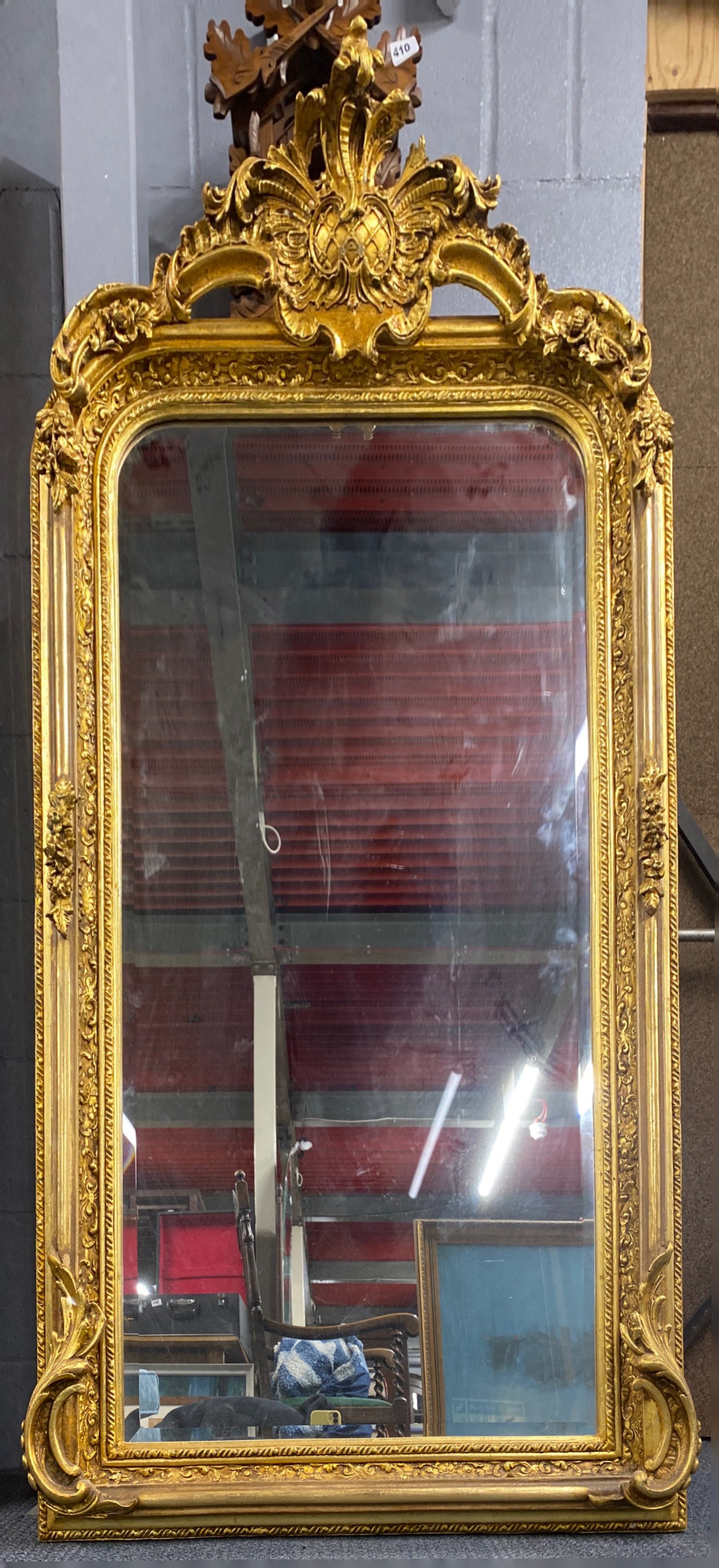 A large gilt framed bevelled glass mirror, 83 x 156cm.